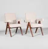 Pair of model 'PJ010808' armchairs by Pierre Jeanneret, c.1953, each of teak with bouclé upholstery, sold Jul 2025