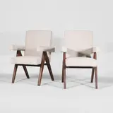 Pair of model 'PJ010808' armchairs by Pierre Jeanneret, c.1953, each of teak with bouclé upholstery, sold Jul 2025