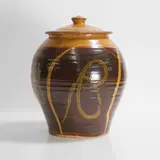 Clive Bowen, Ovoid jar and cover, brown and yellow slip-glazed earthenware