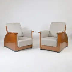 Jean Dunand, Pair of reclining armchairs, 1928, each upholstered in grey fabric