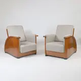 Jean Dunand, Pair of reclining armchairs, 1928, each upholstered in grey fabric