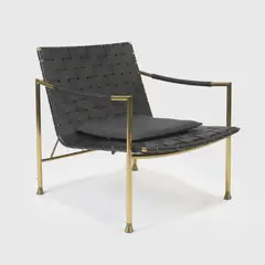 Jonathan Adler, 'Thebes' lounge chair, the woven leather seat supported on a polished brass frame