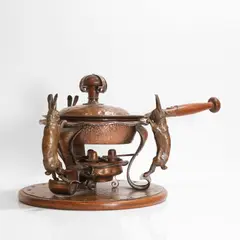 Joseph Heinrichs, Unusual copper and bronze warming pan, c.1908, the hammered copper stand