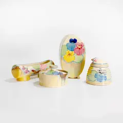 Clarice Cliff, Group of 'Delecia Pansies' pottery items, c.1930