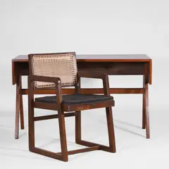 'Monobloc' teak and cane chair by Pierre Jeanneret, c.1960, and a teak student's desk, sold Apr 2025