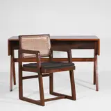 'Monobloc' teak and cane chair by Pierre Jeanneret, c.1960, and a teak student's desk, sold Apr 2025