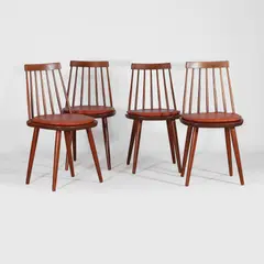 Yngve Ekstrom, Set of four 'Pinocchio' dining chairs, each with a spindle back above a solid seat with tan leather cushion