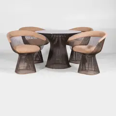Dining suite comprising: a circular dining table by Warren Platner, c.1960s, the circular glass top over a curved and circular steel base, sold Apr 2025