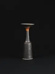 Cylindrical vase with flaring lip by Lucie Rie, circa 1960, Porcelain, manganese and dry terracotta glazes, sold Dec 2023