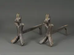 Paire de chenets zoomorphes by Travail Français, Fer forgé, bronze doré et fonte, offered May 2024