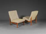 Travail Danois, Paire de chauffeuses, A stamped pair of Danish low chairs in teak and fabric edited by France & Son circa 1957-1966