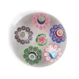 French Spaced Cane Glass Paperweight, the central cane formed as a rose bud, ht. 2, dia. 2 3/4 in., the central cane formed as a rose bud, ht