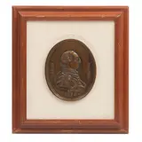 MEDIADOS DEL SIGLO XX by Medallón Con Efigie de Carlos Iii, Bronce, patinado en color marrón; enmarcado, sold Feb 2025