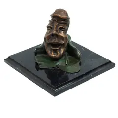 Rostro Sonriendo, SIGLO XX, Bronce, patinado en color verde y marrón; base de mármol negro