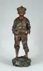 V. Szczeblewski, Mousse Siffleur, Bronze figure of a boy with hands in pocket wearing cap and whistling. Naturalistic base having crab inside