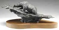 Tim Whitworth, Spring Run, Limited edition bronze depicts a large bear knee deep in flowing river grabbing a jumping salmon in his mouth