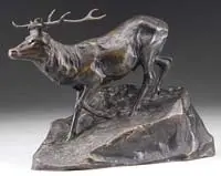 Stag by Hans Müller, Bronze sculpture showing a stag with large antlers descending on rocky plinth, sold Aug 2009