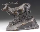 Hans Müller, Stag, Bronze sculpture showing a stag with large antlers descending on rocky plinth
