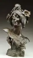 Cadet-Julien Causse, Floreal-June, Bronze sculpture bust of a woman with flowers in her hair on a naturalistic base with leaf decoration. Dark brown patina