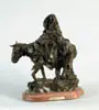 Herb Mignery, Blizzard of 88, Bronze sculpture shows woman on horseback with man beside in deep snow bundled up against the fury of the blizzard