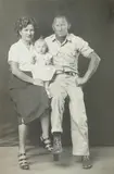 Mike Disfarmer, Husband, wife, and child, circa 1940, Gelatin silver print