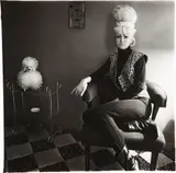 Lady bartender at home with souvenir dog, New Orleans by Diane Arbus, 1964, Gelatin silver print, printed later by Neil Selkirk, sold Oct 2014