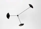 Serge Mouille, Three-armed wall light with "Moule" shades, circa 1955, Painted aluminum, painted tubular steel, brass