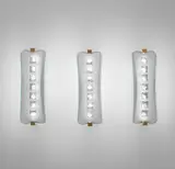 Max Ingrand, Set of three wall lights, model no. 1568, circa 1956, Frosted and partially chiseled glass, brass, nickel-plated metal