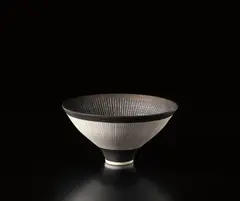 Conical bowl by Lucie Rie, circa 1980, Porcelain, manganese glaze, sgraffito and inlay, sold Dec 2014