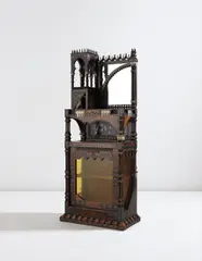 Carlo Bugatti, Cabinet, circa 1900, Mahogany, brass, pewter, and mother-of-pearl marquetry-veneered wood, carved mahogany, colored glass, mirrored glass, pressed cork, parchment, repoussé copper, reticulated brass mounts, bone, silk tassels