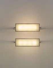 Pierre Legrain, Pair of wall lights, from the study of Roger Martin du Gard, Paris, circa 1926, Nickel-plated metal, frosted glass
