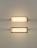 Pierre Legrain, Pair of wall lights, from the study of Roger Martin du Gard, Paris, circa 1926, Nickel-plated metal, frosted glass