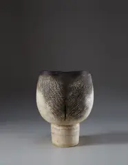 Important and large goblet form with vertical impressions by Hans Coper, 1968, Stoneware, layered white porcelain slips and engobes, over a textured body, the interior with manganese glaze, sold Dec 2014