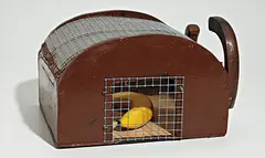 Andreas Slominski, Monkey Trap, 2004, wood, metal, paint, plastic, and banana