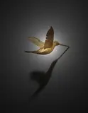 Terrence Koh, JP Huitzilopochtli (Fallen Warrior), 2007, hummingbird drenched in warrior's piss, feathers, armature, gold paint, 24 karat gold leaf