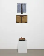 Josephine Meckseper, Der Spiesser und die Agonie des Realen (The Bourgeois and the Agony of the Real), 2004, pair of Birkenstock sandals, men's dress tie, patterned fabric, screen print on metallic coated paper, mirrored glass, pedestal