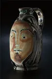 Femme de Barbu (Bearded Man’s Wife) by Pablo Picasso, 1953, White earthenware turned pitcher painted in black, beige, green and gray patina with engobe and knife engraved decoratio, sold Apr 2013