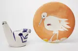 Pablo Picasso, Sujet Colombe (Dove Subject); and Oiseau no. 86 (Bird no. 86), 1959; and 1963, Two ceramics, including one white earthenware turned vase painted in blue and black with decoration, knife engraving and enamel, and one white earthenware turned plate painted in colors with partial brushed glaze and enamel,