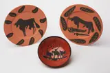 Pablo Picasso, Taureaux, Marli aux Feuilles (Bull, Rim with Leaves); Picador (Picador); and Scene de Tauromachy (Tauromachy Scene), 1957; and 1953, Three red earthenware ceramics, including one turned cupel painted in black with paraffin and glaze, and two turned round plates painted in black with knife engraving,