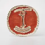 Visage au Nez Pincé (Face with Pursed Nose) by Pablo Picasso, 1959, White earthenwre round/square plate, painted in red patina, black and ivory with decoration and partial brushed glaze,, sold Apr 2013