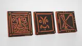 Petit Visage Barbu (Little Bearded Face); Masque Rieur (Laughing Mask); and Visage Stylisé à L'y (Y-stylized Face) by Pablo Picasso, 1968; and 1969, Three red earthenware square plaques painted in black,, sold Apr 2013