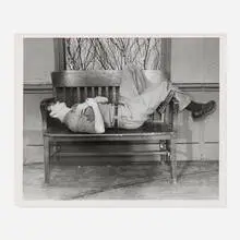 Untitled (Man Sleeping on Window Bench) by Weegee, c. 1950, vintage gelatin silver print, sold May 2026