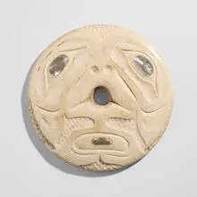Tlingit, Spindle whorl with carved face, bone, mother-of-pearl