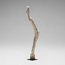 Curved Nommo figure by Dogon, carved and painted wood, sold Dec 2025