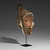 Dan, Gunyege mask, carved and painted wood, metal, Cowrie shells, cloth, hair