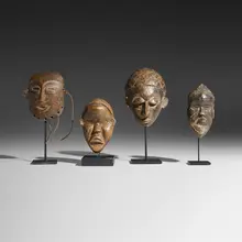 African, Collection of four passport masks, carved wood, rope