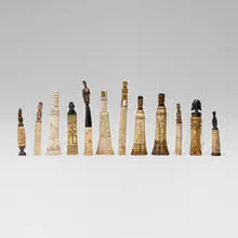 Indonesian, Collection of twelve lime powder containers, carved bone, carved wood, horn, fibers