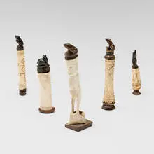 Indonesian, Collection of five lime powder containers, carved bone, carved wood