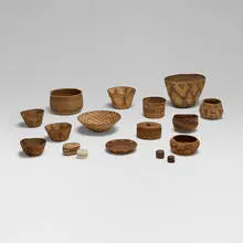 Native American, Collection of seventeen baskets, woven grass, sinew