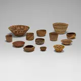 Native American, Collection of thirteen baskets, woven grass